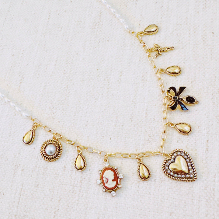 Heart & Cameo Charm Necklace – Romantic Gold Chain with Bow and Vintage-Inspired Details
